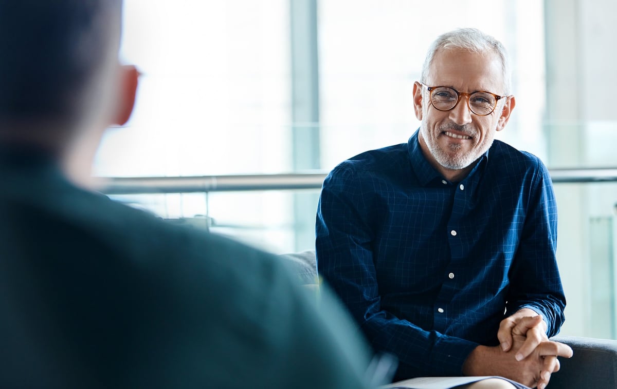 Mature professional listening attentively in real conversation